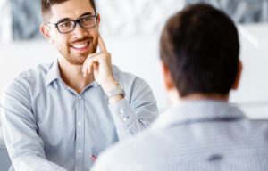 Happy man with glasses in counselling